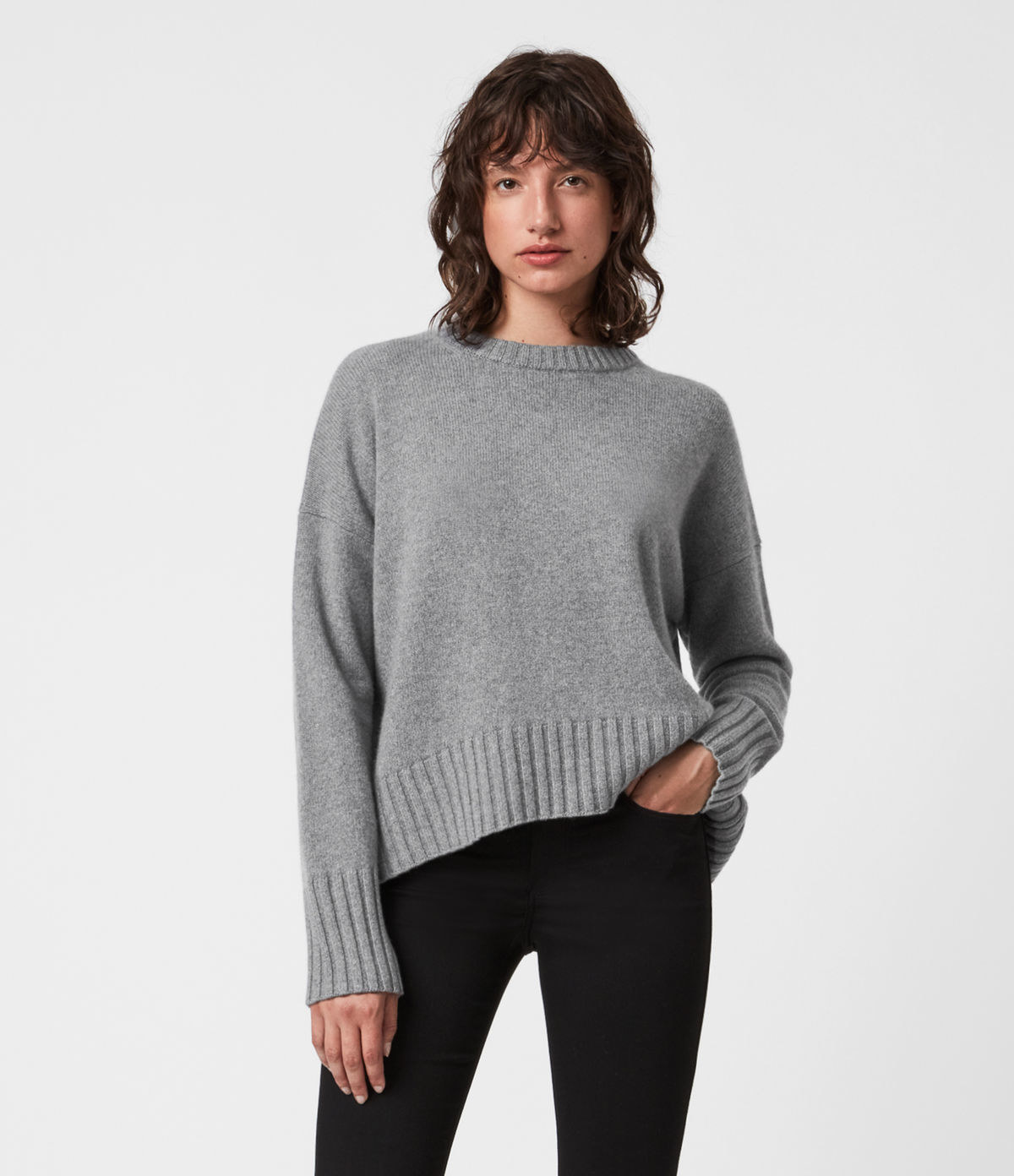 a model in a grey sweater