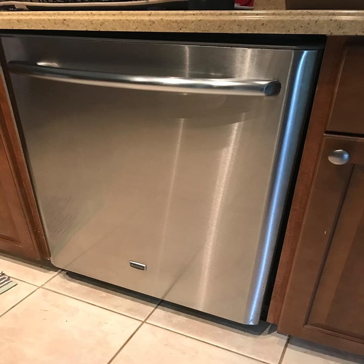 After: the same dishwasher, now clean looking new