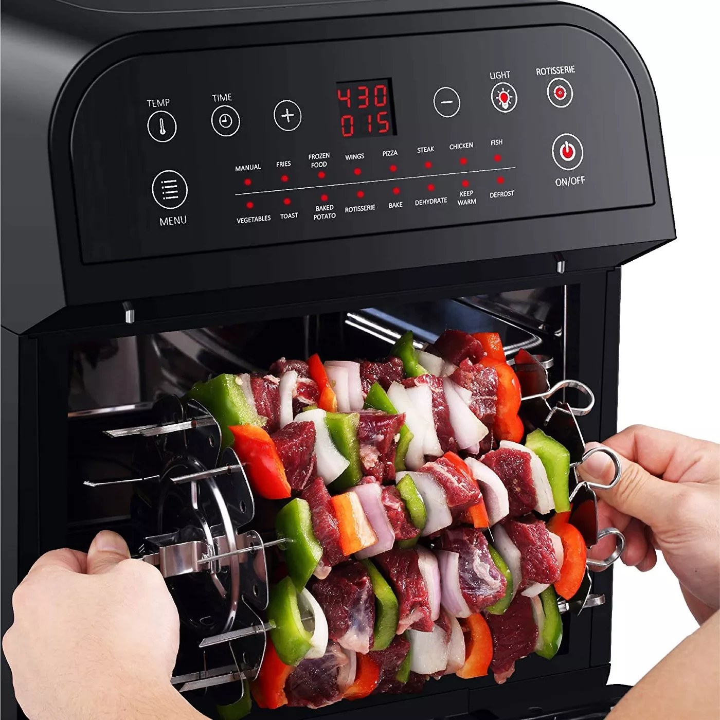 The small oven with the skewer rotisserie insert