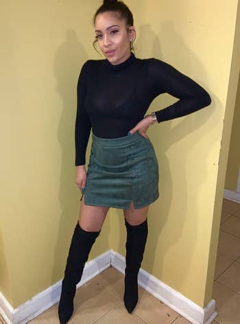 reviewer wearing green lace-up skirt
