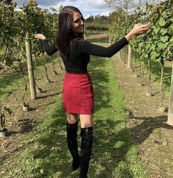 reviewer wearing red mini skirt 