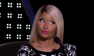 Nicki Minaj rolling her eyes and making a face