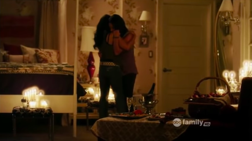 Emily and Maya dancing in candlelit bedroom