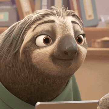 A sloth from Zootopia slowly grins joyfuly