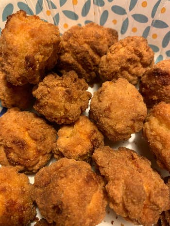 A plate of crispy fritters fresh out of the air fryer.