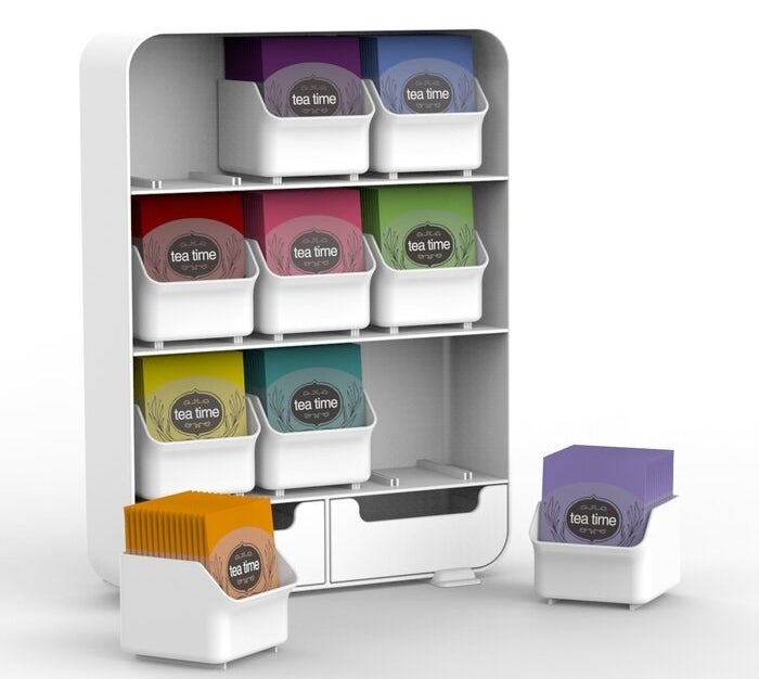 The tea organizer in white holding various flavors of tea bags