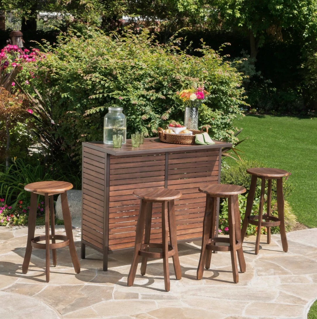 A wooden bar with four bar stools outside on a patio 