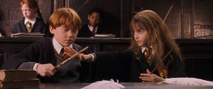 Hermione teaching Ron how to pronounce a certain charm we all know and love