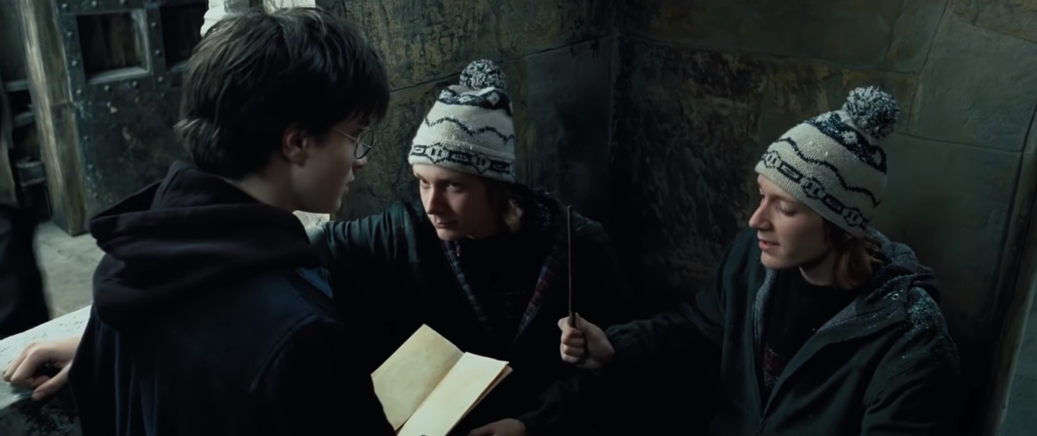 Fred and George teach Harry how to use the Marauders map 
