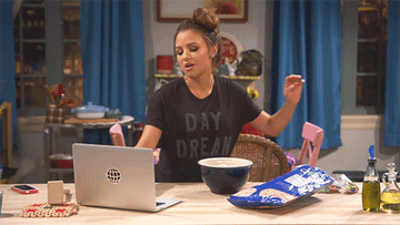 A gif of Sophia from &quot;Young &amp;amp; Hungry&quot; dancing in front of her computer