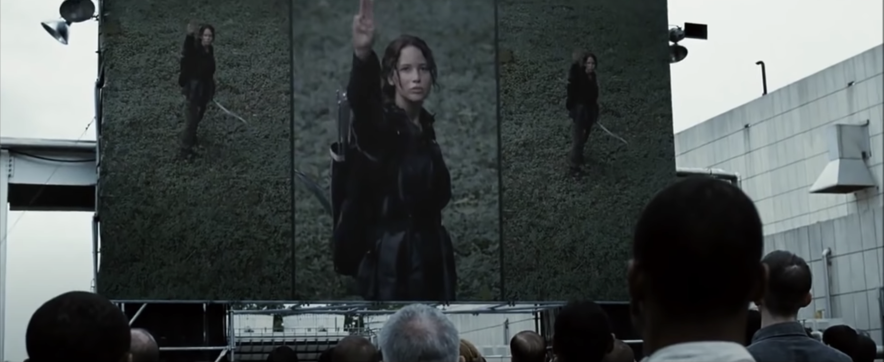 Katniss gives the Three Finger Salute