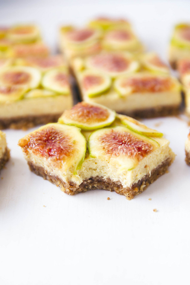 A slice of honey fig cheesecake with a bite taken out of it.