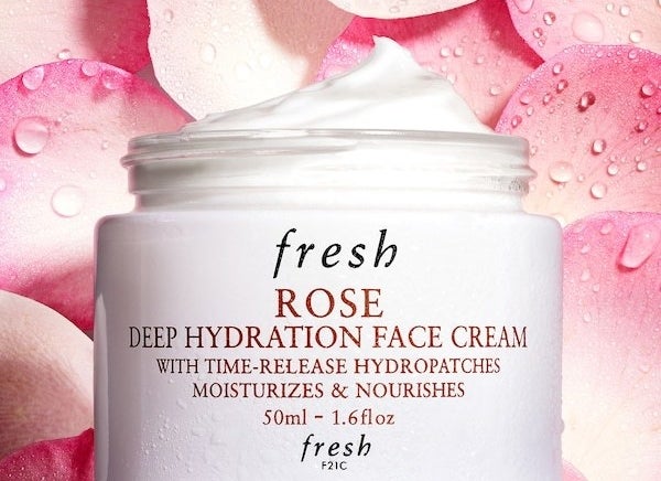 The tub of the face cream — the cream is white