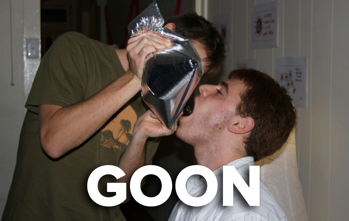 A man drinking wine from a silver aluminium wine (goon) sack 