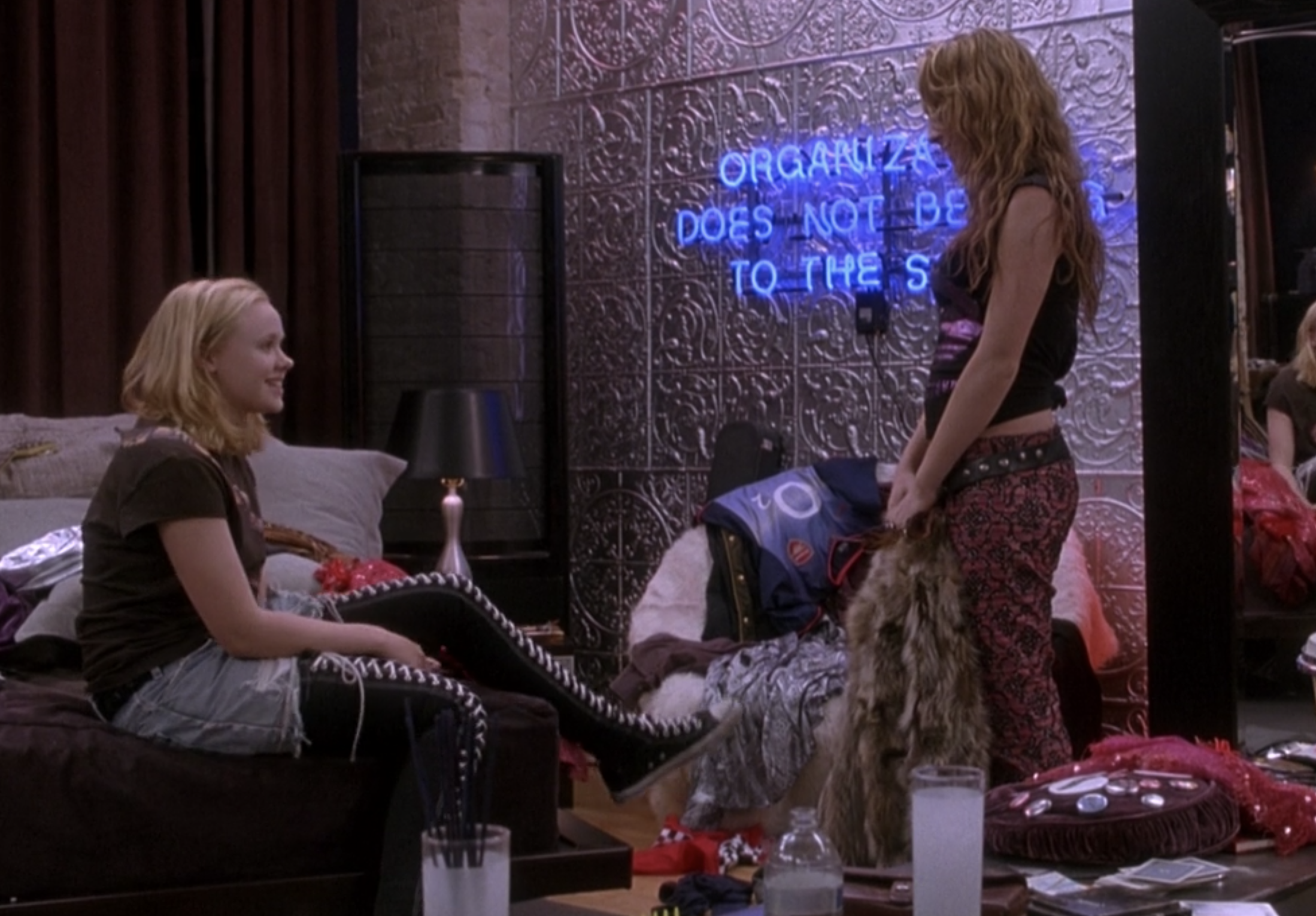 Alison Pill wears thigh-high Converse sneakers as Ella and Lindsay Lohan wears low-rise patterned pants with a belt slung across them as Lola in &quot;Confessions of a Teenage Drama Queen&quot;