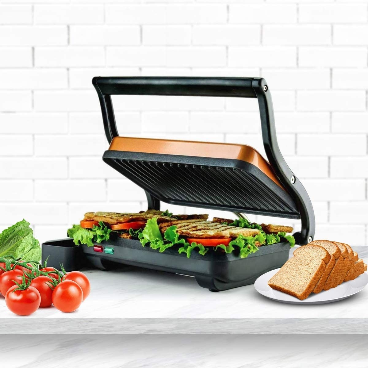 The panini press with a floating lid and a grilled sandwich inside