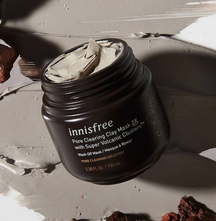 the gray mask in a dark brown jar
