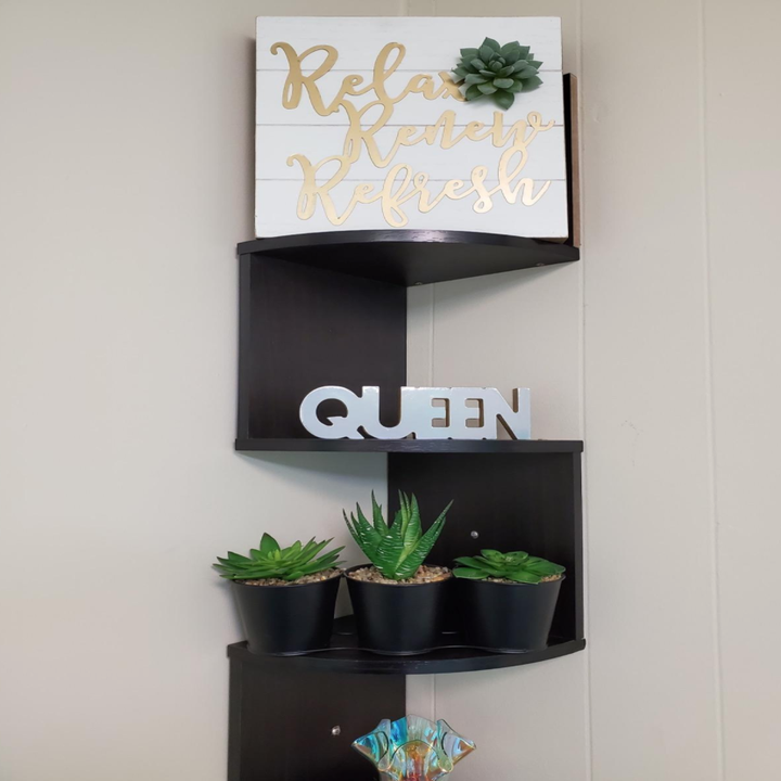 The product in espresso mounted to the wall