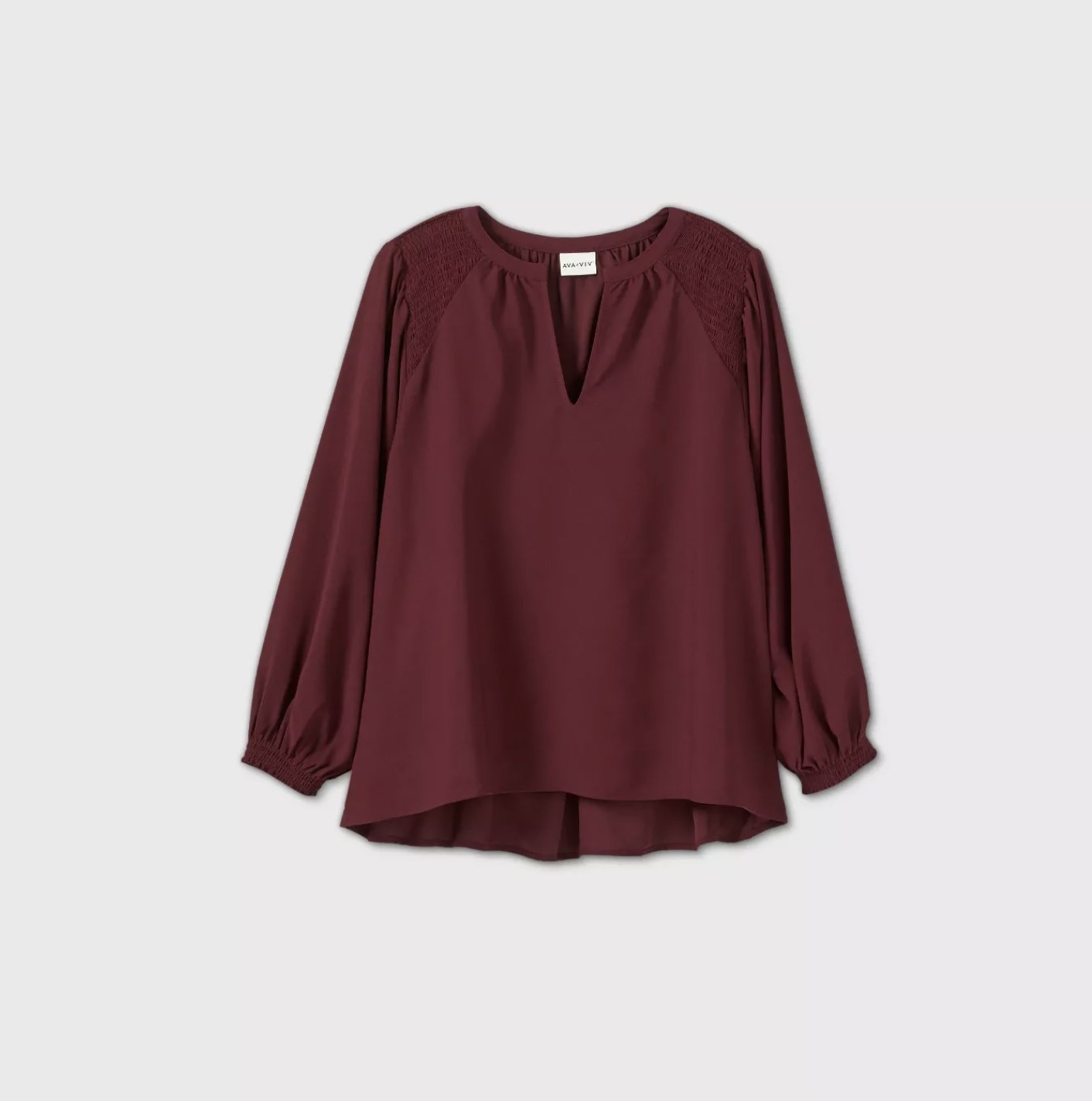 A burgundy blouse with billowy sleeves and a v-neckline