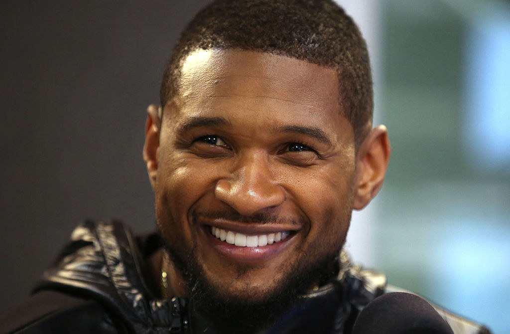 Usher smiling big