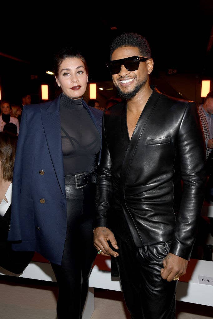 Usher smiling with his girlfriend Jenn