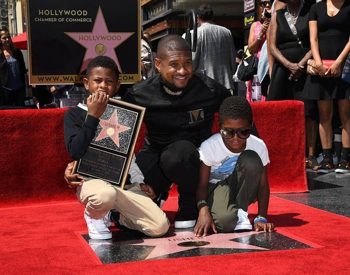 Usher with his sons on his Hollywood star
