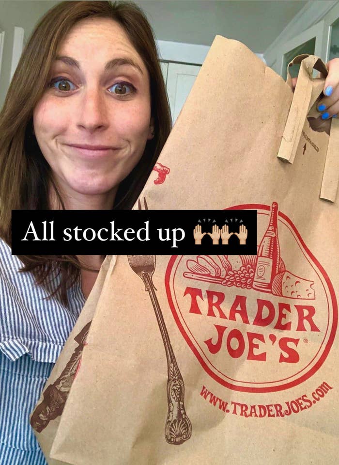 The author holding a Trader Joe's bag after grocery shopping.