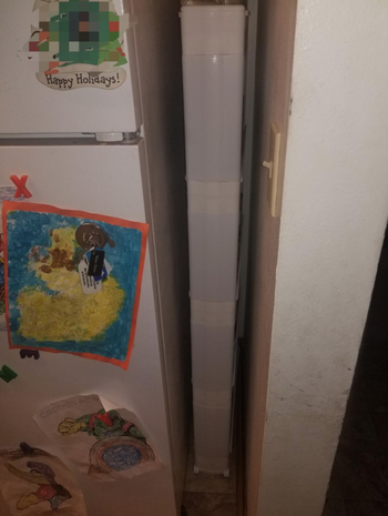 The product, completely concealed, next to the fridge