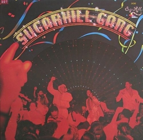 album cover of Sugarhill Gang showing members of the group rapping with mics to a crowd of people