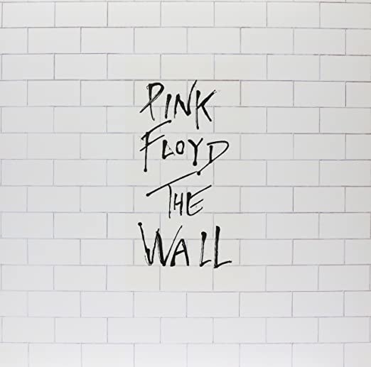 album cover of The Wall showing a brick wall with the name of the band and album written over it