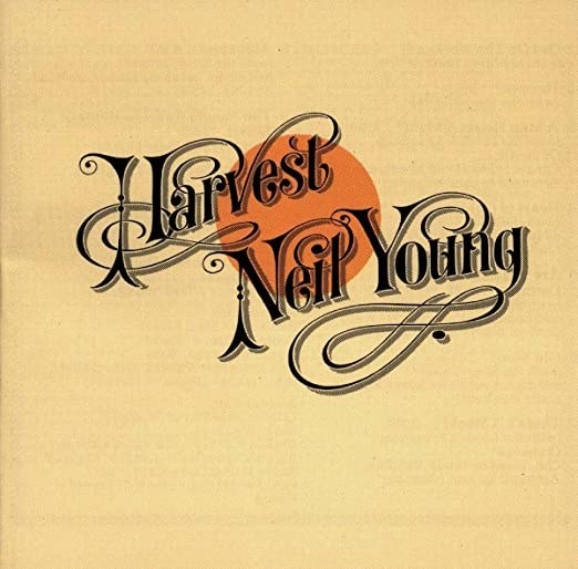 album cover of Harvest with an orange circle on a yellow background