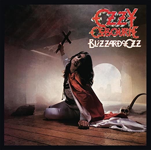 album cover of Blizzard of Ozz with Ozzy Osbourne holding a cross as he sits on the floor