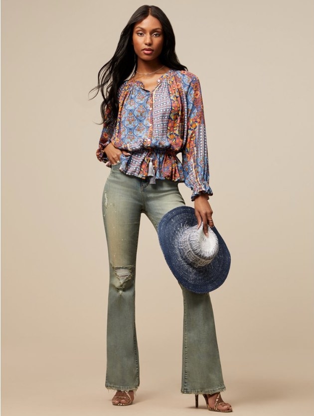Model wearing paisley blouse