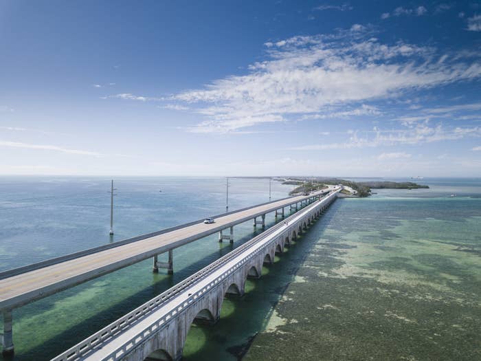 aerial view of Seven Mile Bridge over the ocean on a clear, sunny day
