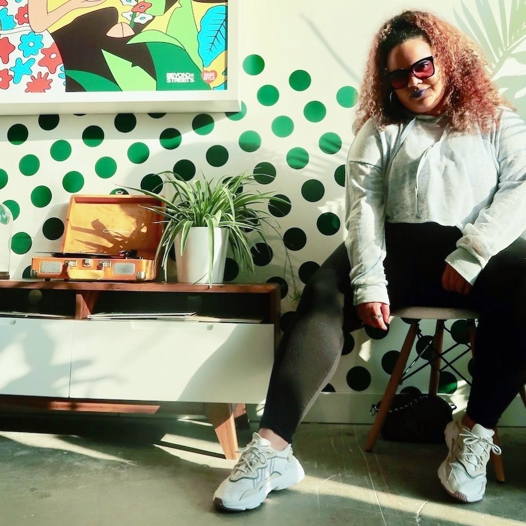 Kayla wearing the white chunky sneakers with beige accents
