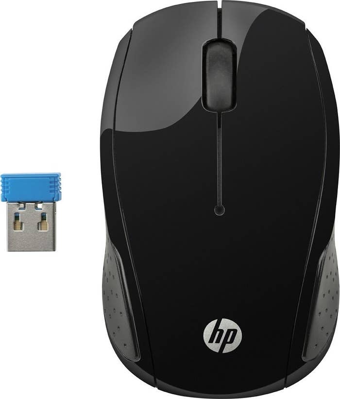 A black HP 200 wireless mouse with a bluetooth USB connector