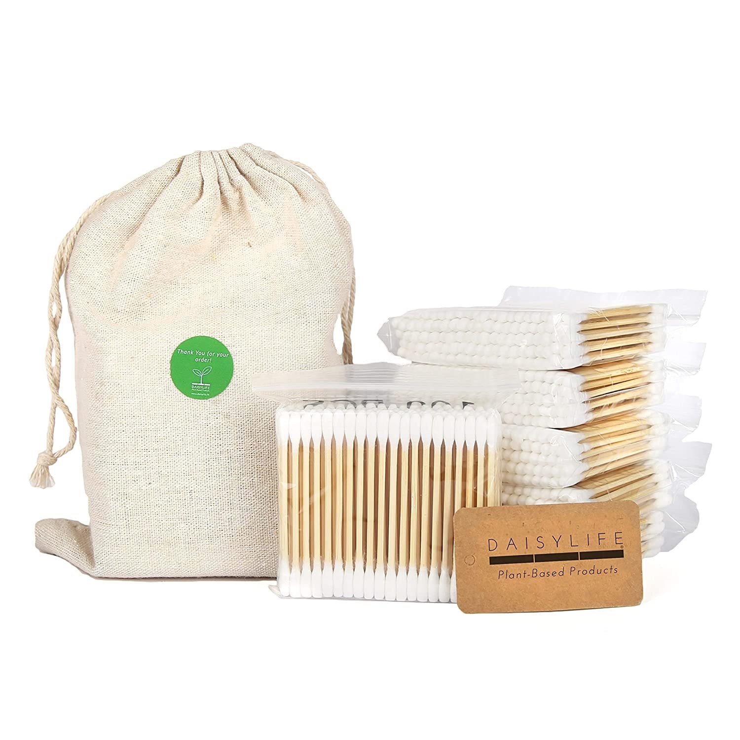 Multiple packs of wooden cotton swabs next to a carrying pouch