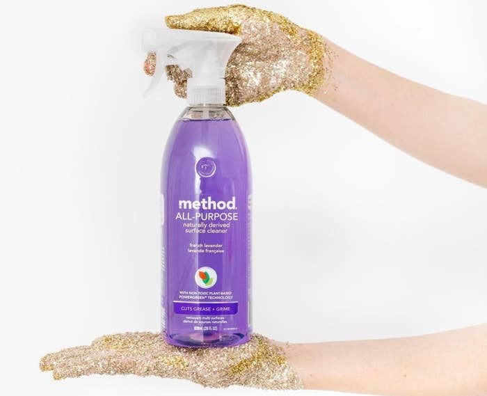 Hands holding bottle of Method cleaner