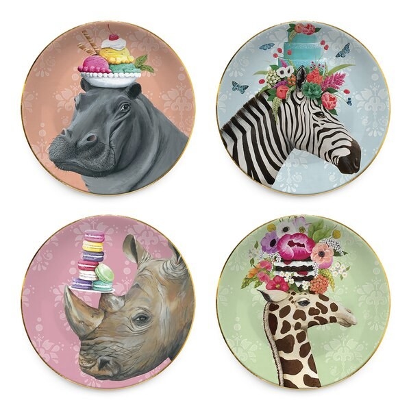 Four plates featuring illustrations of a zebra, a giraffe, a hippo, and a rhinoceros — posing with desserts