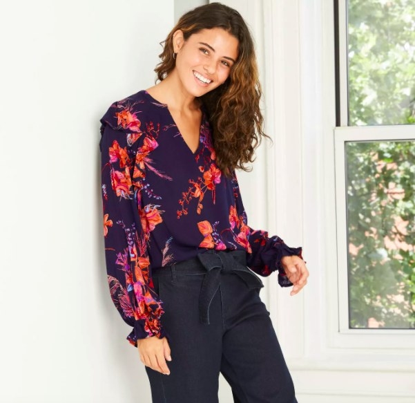 Model wearing the navy blouse