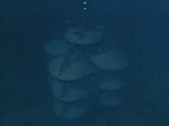 A underwater establishment, built of stacked circular buildings