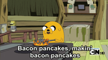 Animated dog making pancakes and singing, &quot;Bacon pancakes, makin&#x27; bacon pancakes&quot;
