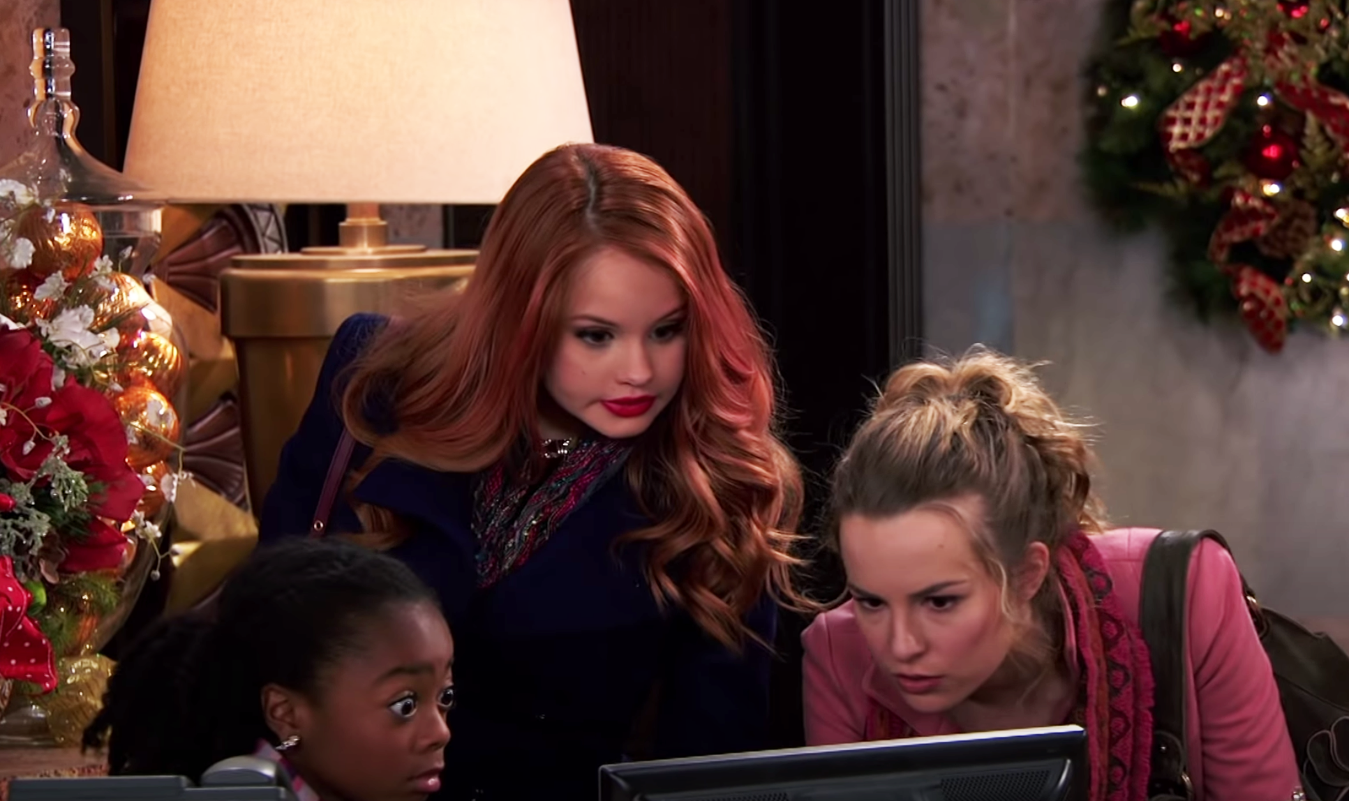 Jessie and Zuri from &quot;Jessie&quot; watch a video on a computer with Teddy from &quot;Good Luck Charlie&quot;