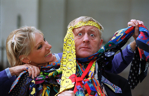 man with tie around his head and ties around his neck