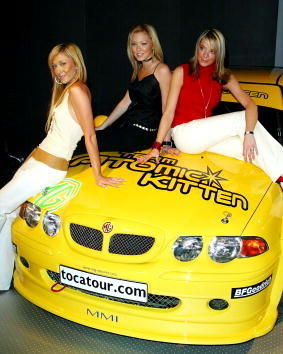 three women sat on yellow car 