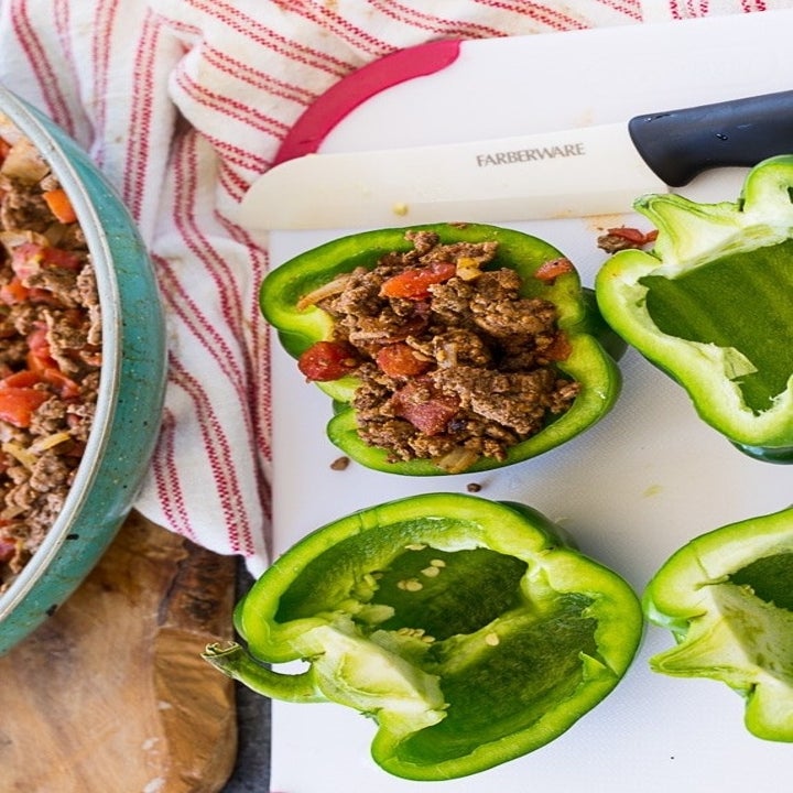 Halved peppers stuffed with ground meat and tomato filling.