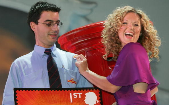 woman putting stamp on man smiling