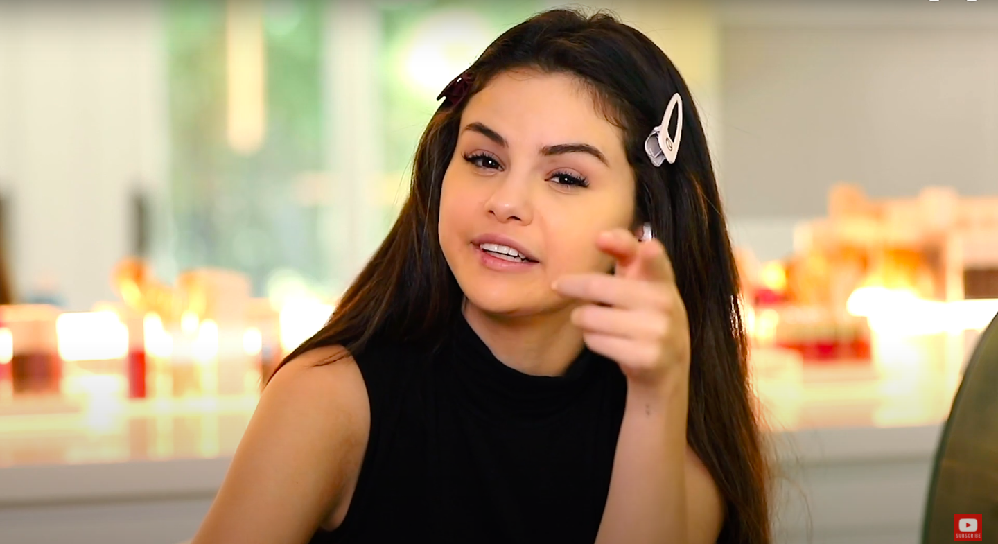 Selena Gomez pointing at camera