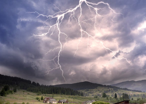 Lightning striking over a small town