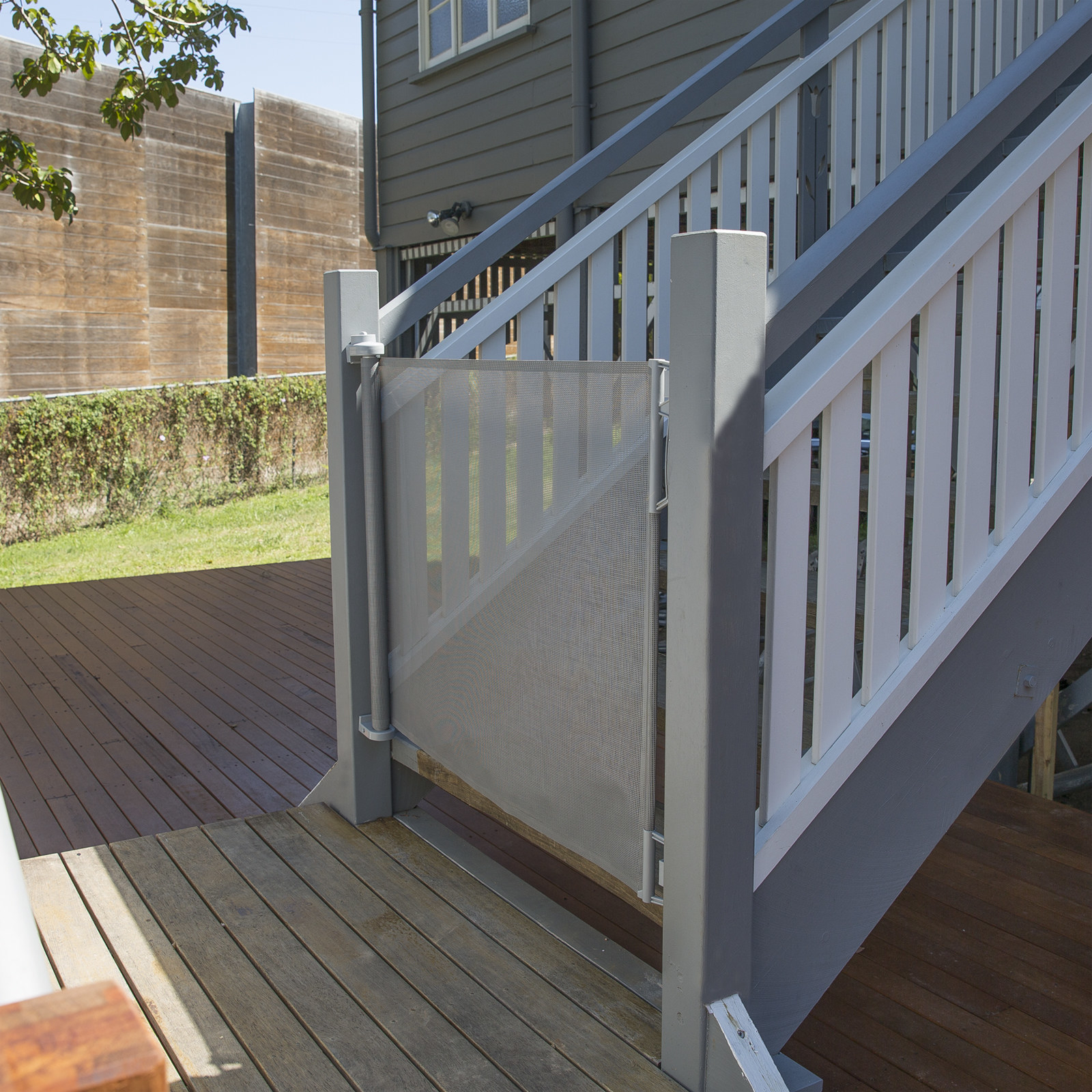 The outdoor gate attached to a set of porch steps